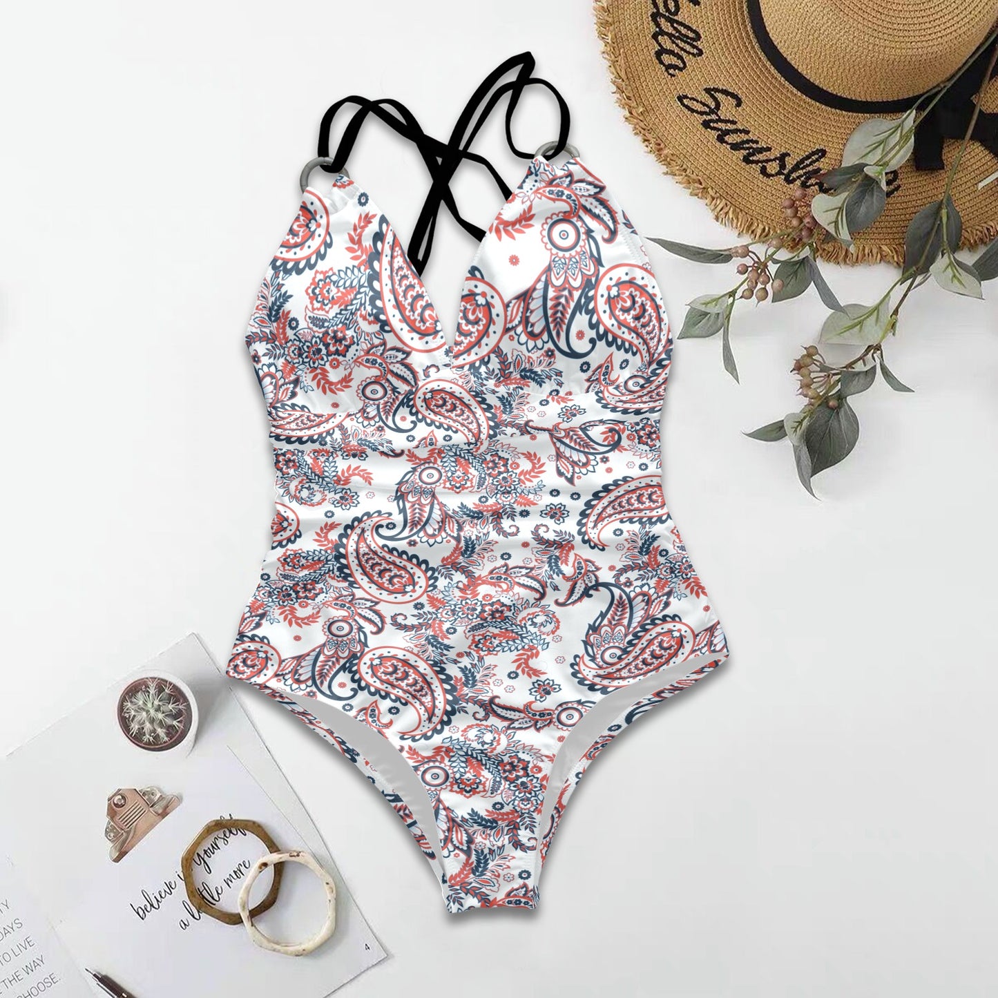 Flat lay paisley one-piece swimsuit with adjustable cross-back straps