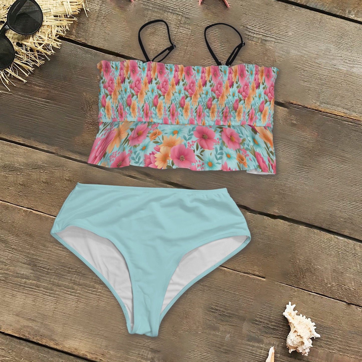 Floral and aqua tankini flat lay with soft structured bodice