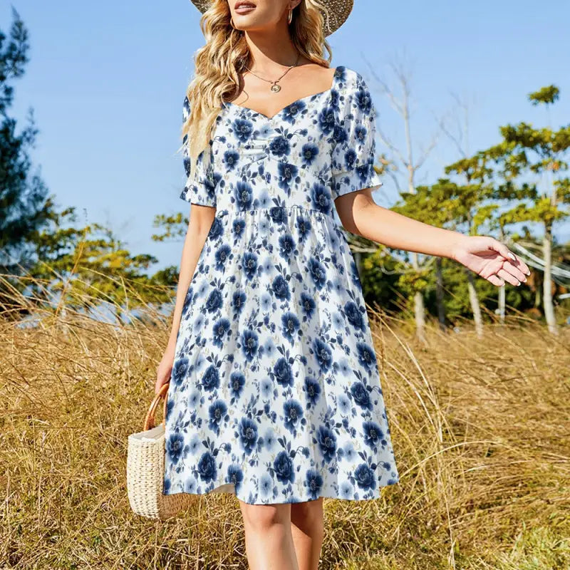 Blue floral sweetheart dress with puff sleeves and knee-length skirt for a cottagecore vibe