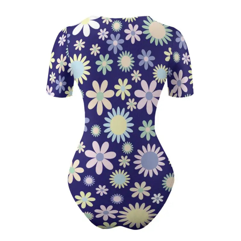 Blue floral short sleeve bodysuit with a fun floral pattern on navy blue background
