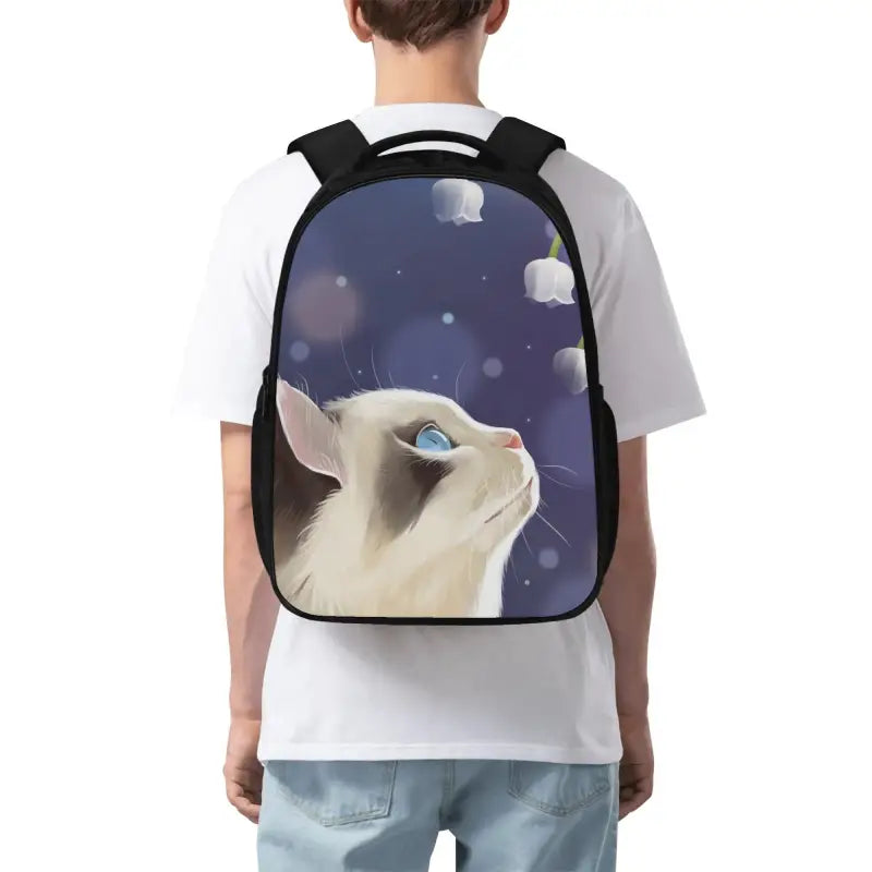 Whimsical cat design on a durable polyester dual compartment school backpack with adjustable shoulder straps