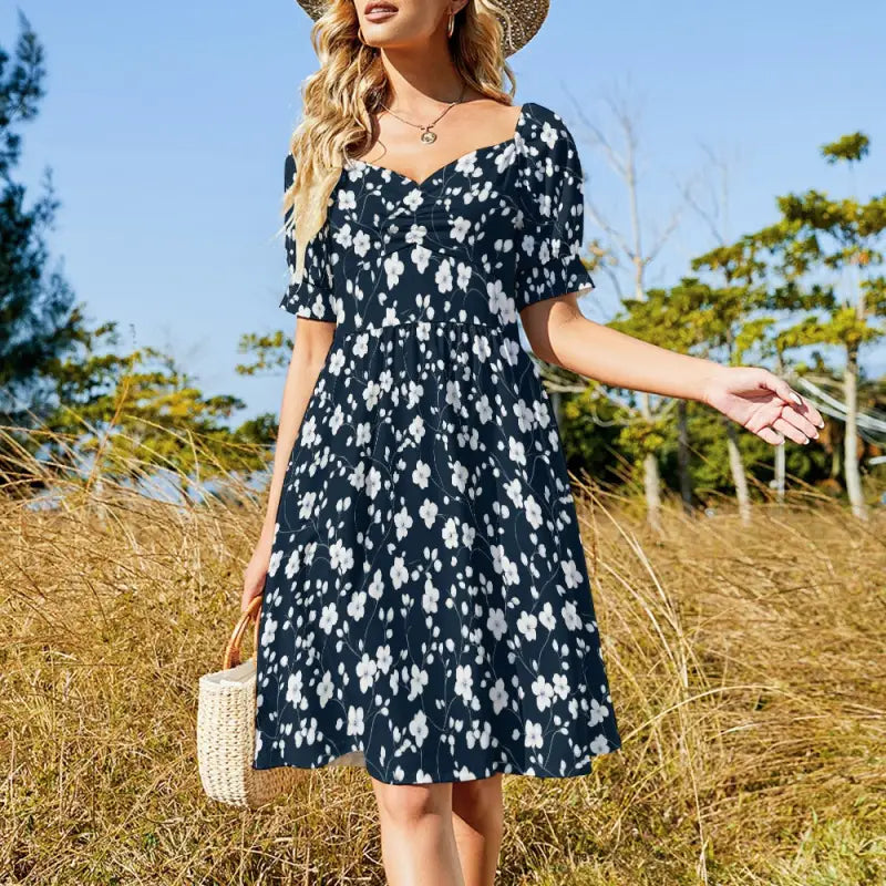 Navy blue floral sweetheart dress with puffed sleeves and gathered waist, perfect for dancing