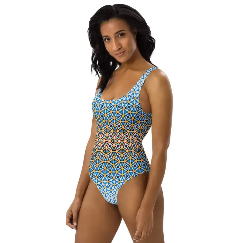 Colorful blue geometric tank style one-piece swimsuit with yellow pattern for summer fun