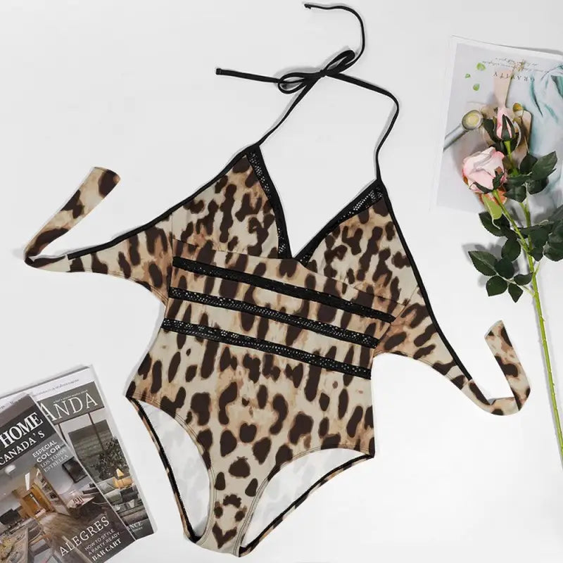 Leopard-print one-piece lace insert swimsuit with strappy cutouts for a sassy look