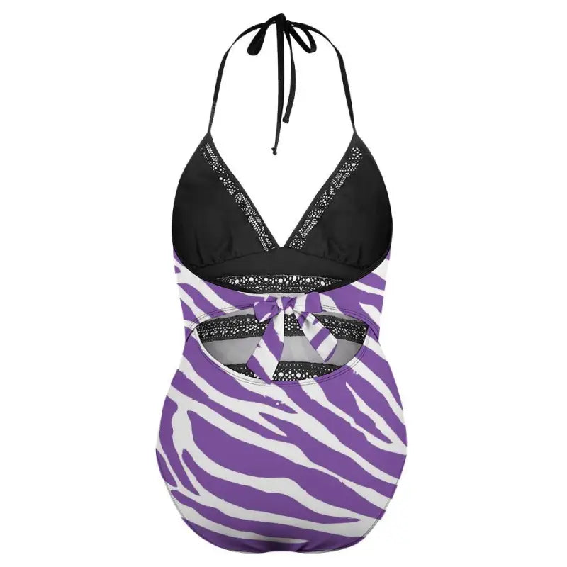One-piece lace insert swimsuit with a black top and purple zebra-striped bottom