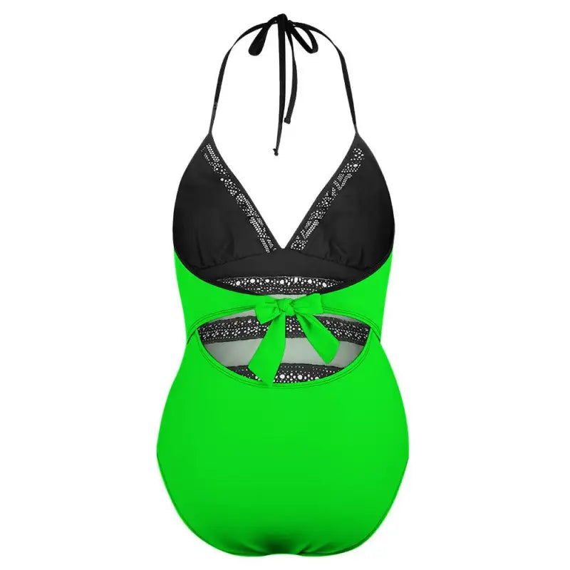 Bright green and black one-piece with lace inset tie details for a stylish beach look