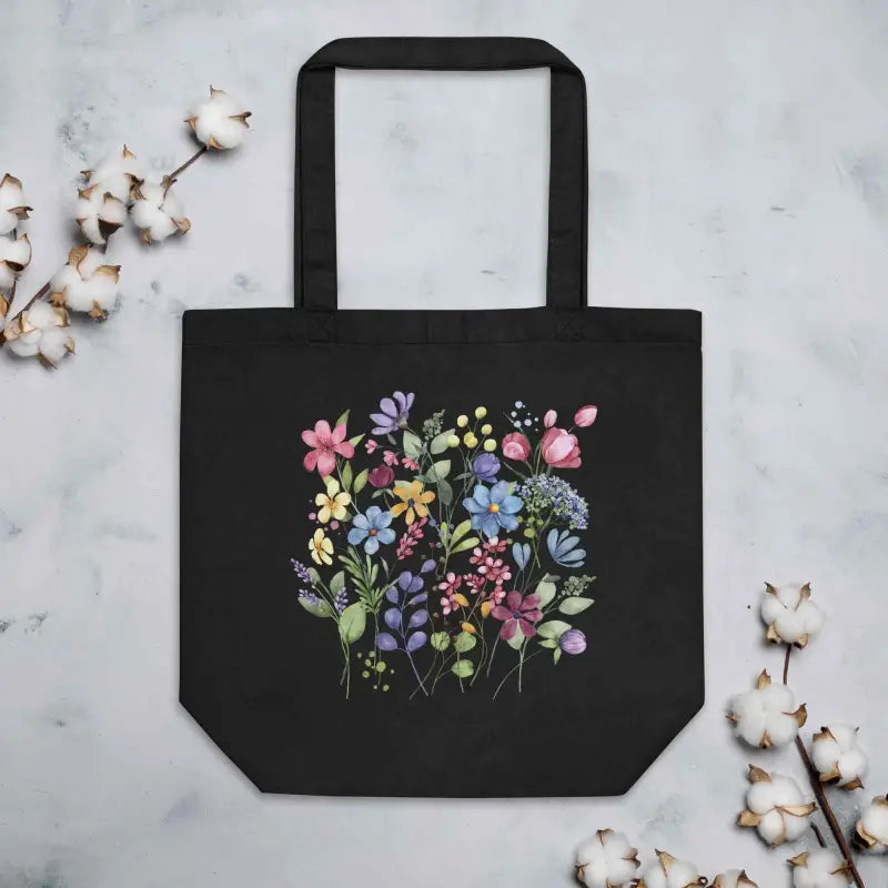 Black tote bag with colorful floral design, perfect for cottage core wildflower vibes