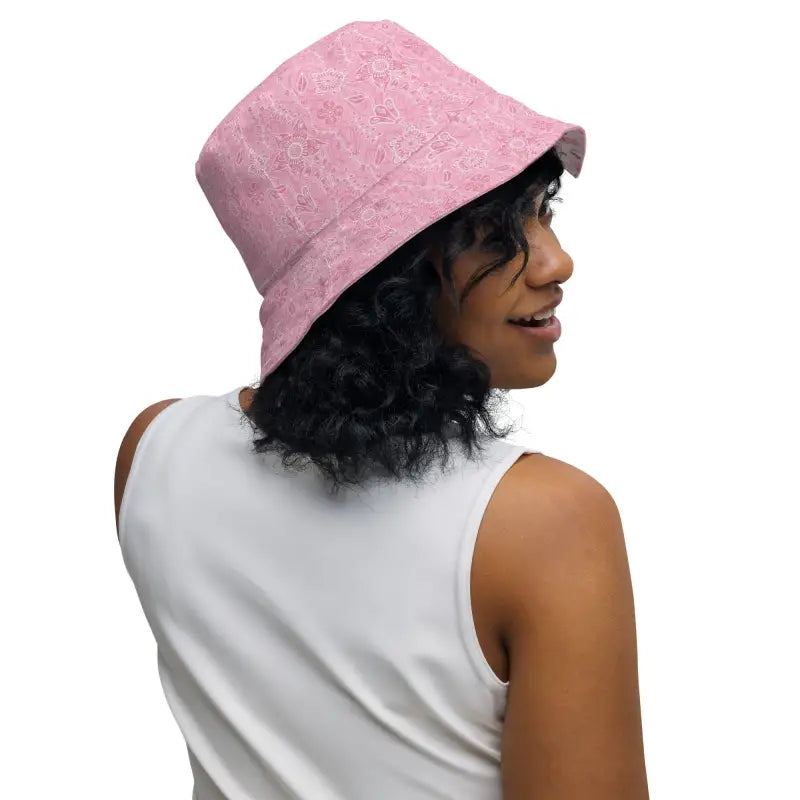 Pink textured bucket hat perfect for sunny days, stylish women’s floral reversible design