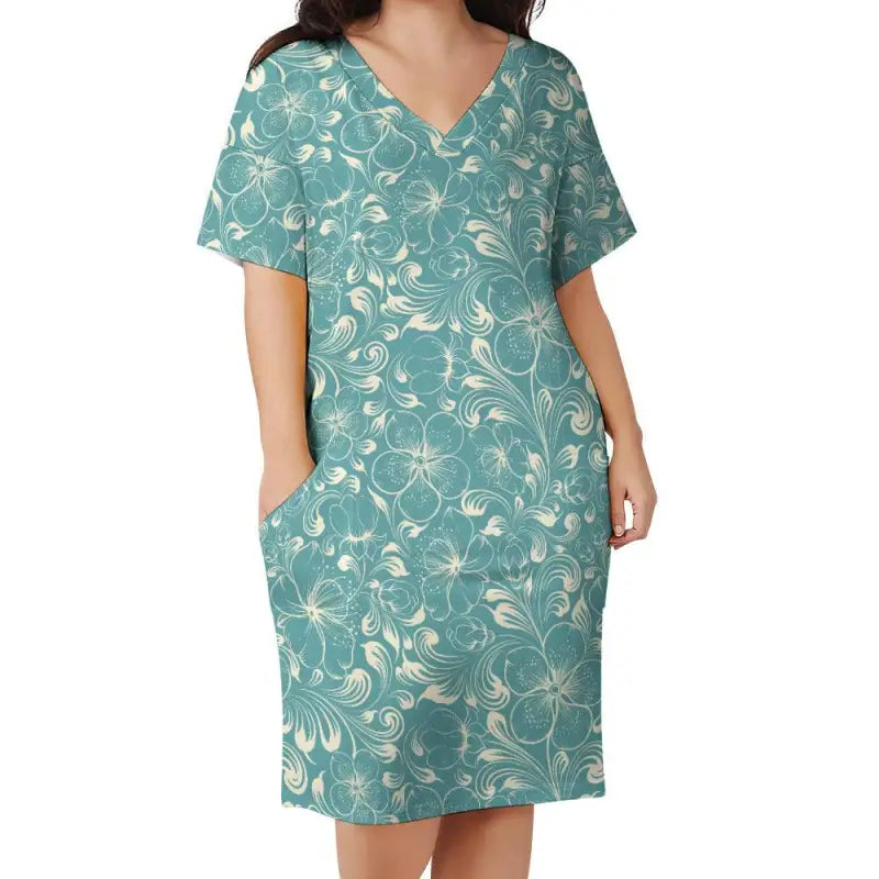Teal floral loose V neck dress with short sleeves and pockets for adventures