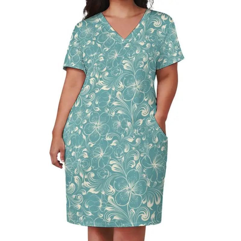 Teal floral loose V neck dress with short sleeves and pockets for all your adventures
