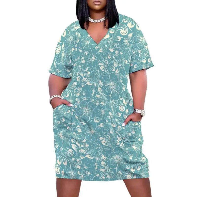 Teal floral loose V neck dress with short sleeves and pockets for all your adventures