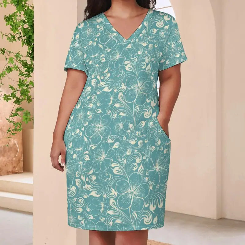 Teal floral loose V neck dress with short sleeves and pockets for everyday adventures