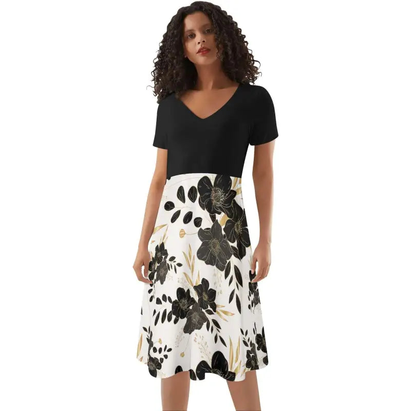 Woman in black top and white floral print skirt, perfect for a ruffle summer dress vibe