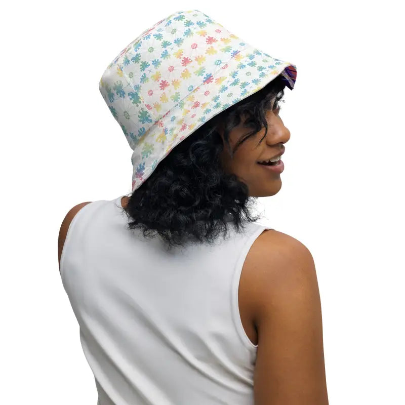 Person with curly dark hair rocking a women’s floral reversible bucket hat