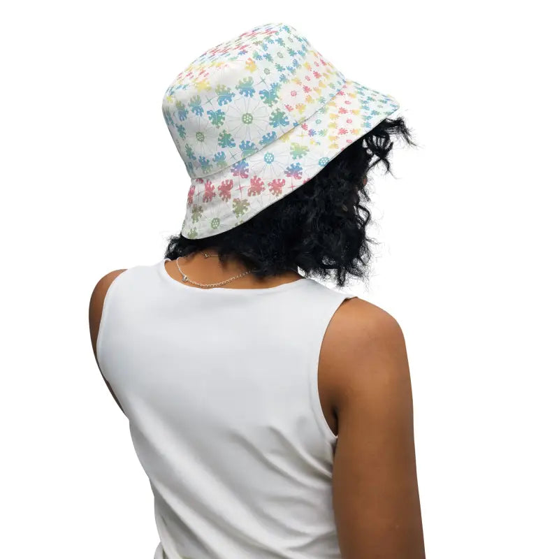 Person with curly dark hair rocks a Floral Reversible Bucket Hat, perfect for women’s style