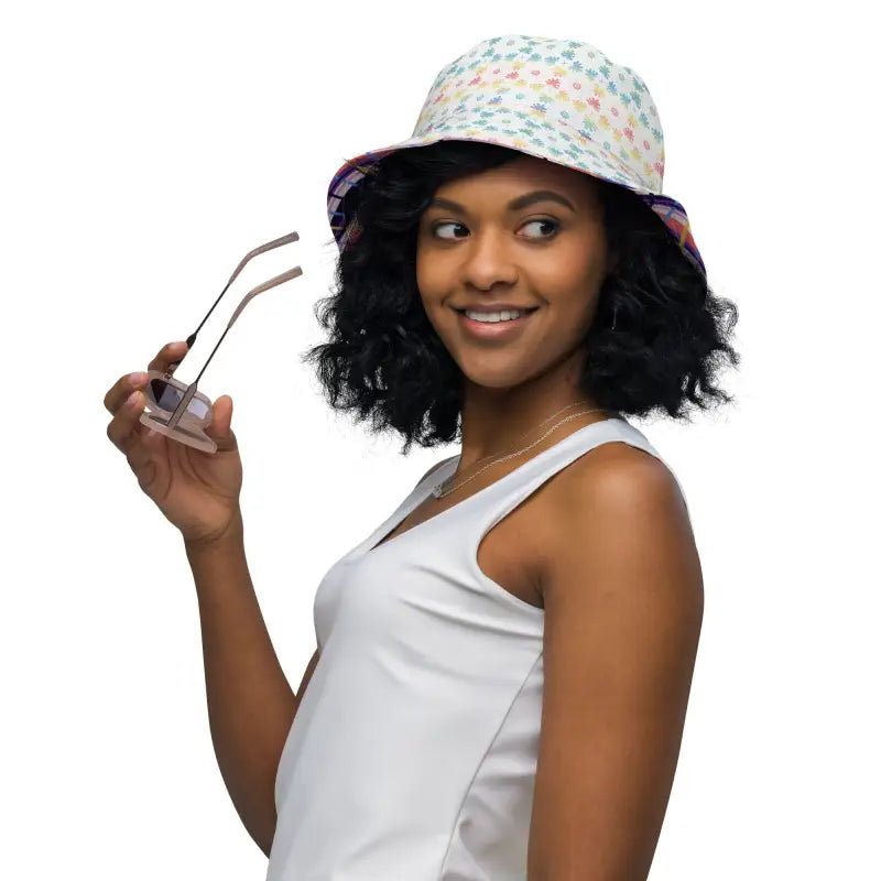 Woman rocking a floral reversible bucket hat and stylish sunglasses for sunny days