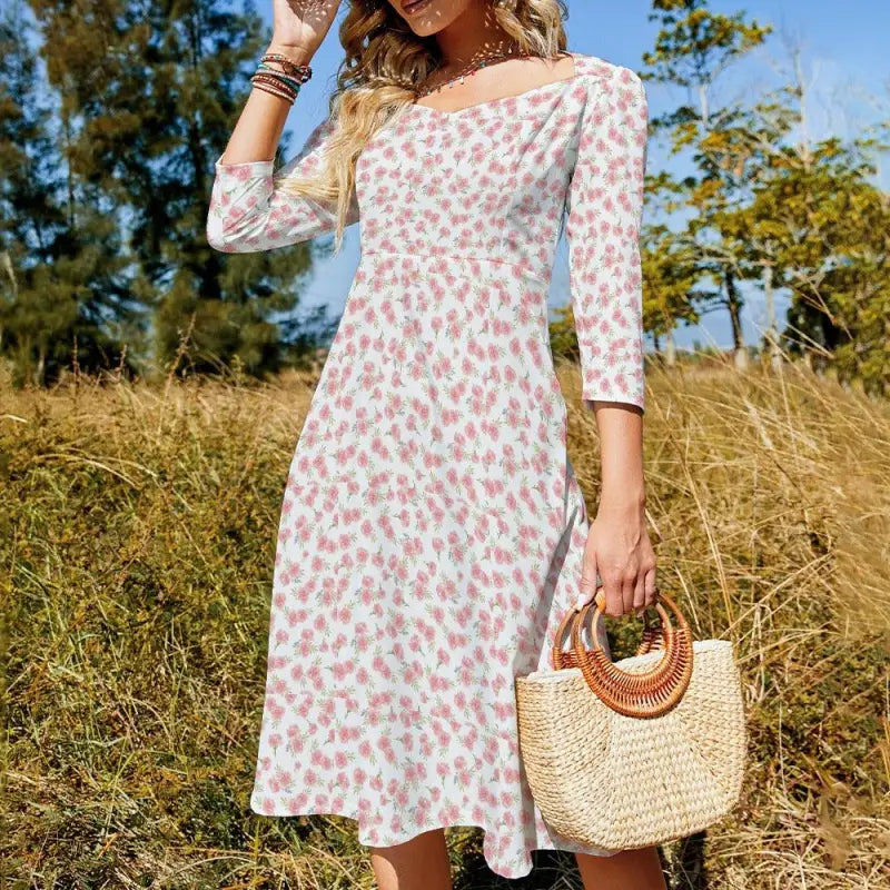 Floral print off-shoulder Floral Sweetheart line dress for women with a chic handbag