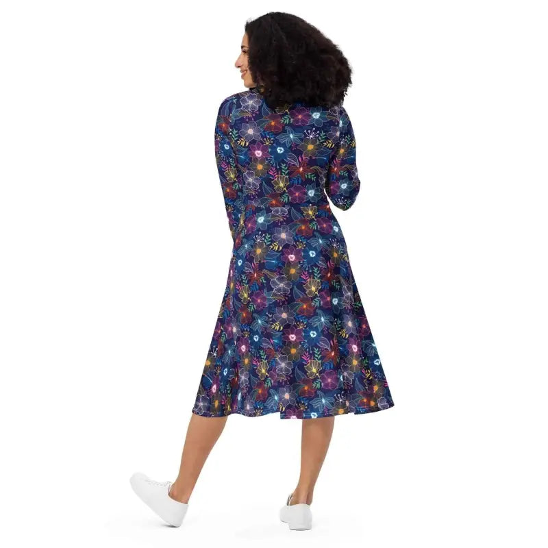 Womens blue floral casual long sleeve midi dress worn by a woman with curly hair