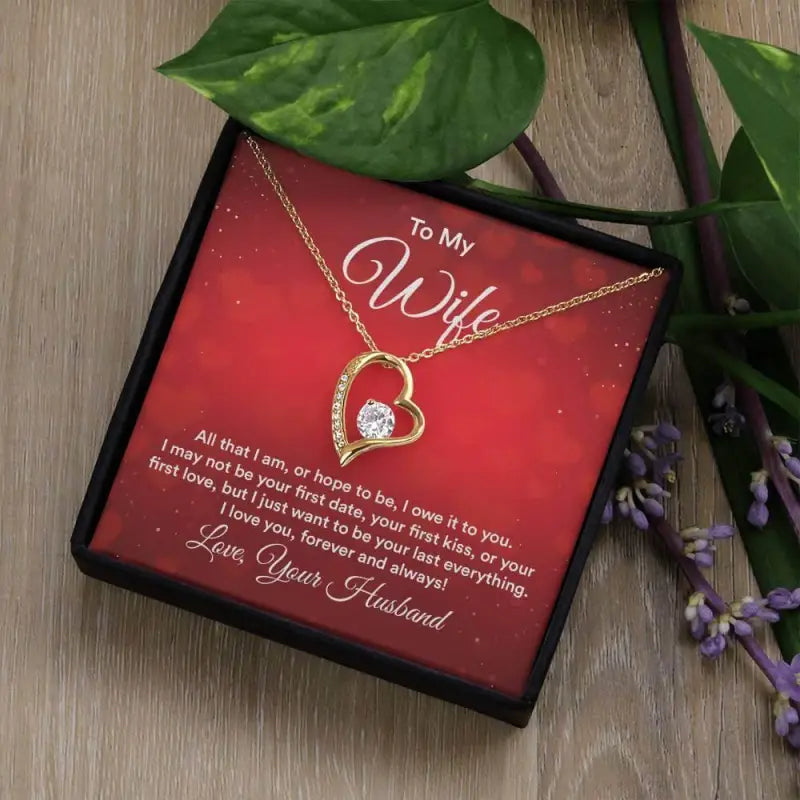 Heart-shaped gold pendant necklace with diamond in gift box for Valentine’s wife card