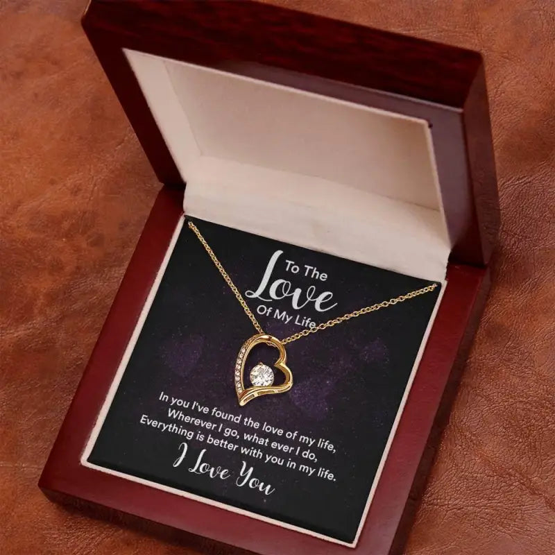 Heart-shaped Forever Love Necklace in a jewelry box with a diamond and yellow gold finish