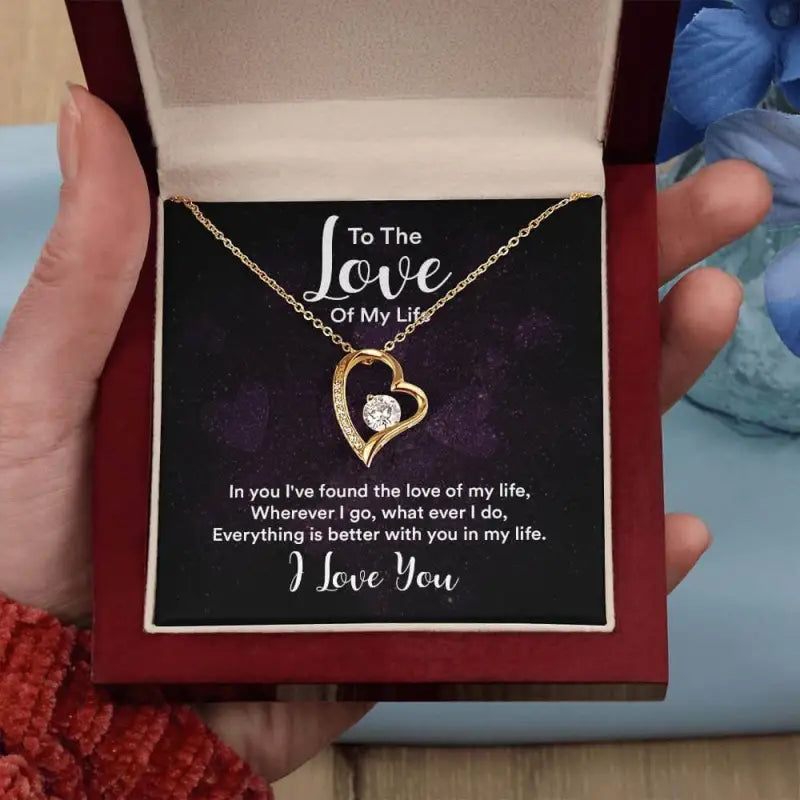 Heart-shaped gold pendant forever love necklace with diamond on a romantic display card