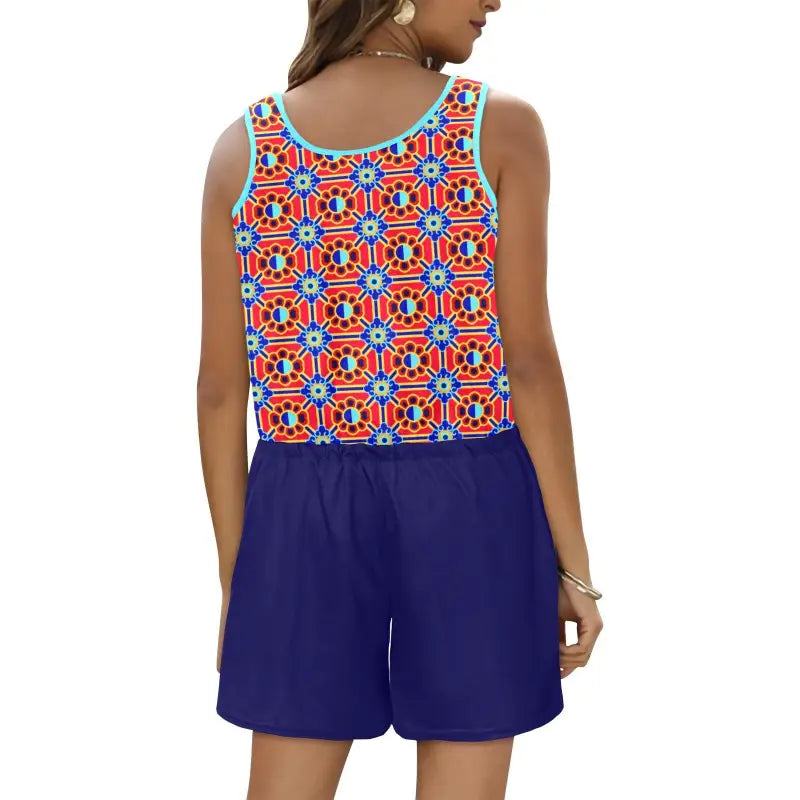 Colorful geometric print sleeveless romper with solid blue shorts for a funky style