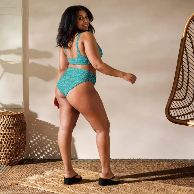 Woman in a teal blue geometric print two-piece swimsuit, perfect for summer vibes