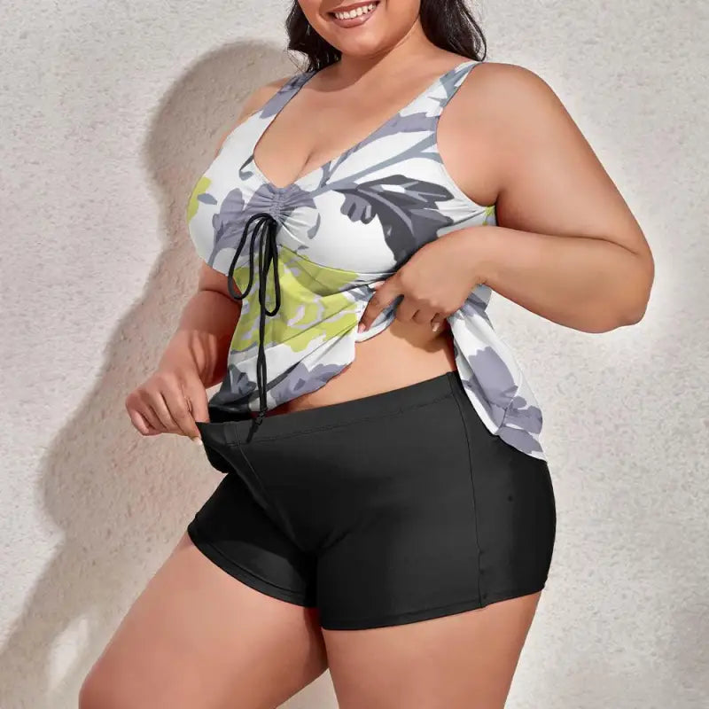 Floral print tankini swimsuit top with black shorts, perfect for plus-size figures