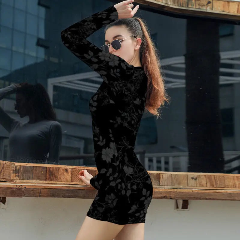 Black bodycon mini dress with elegant long sleeve and form-fitting silhouette