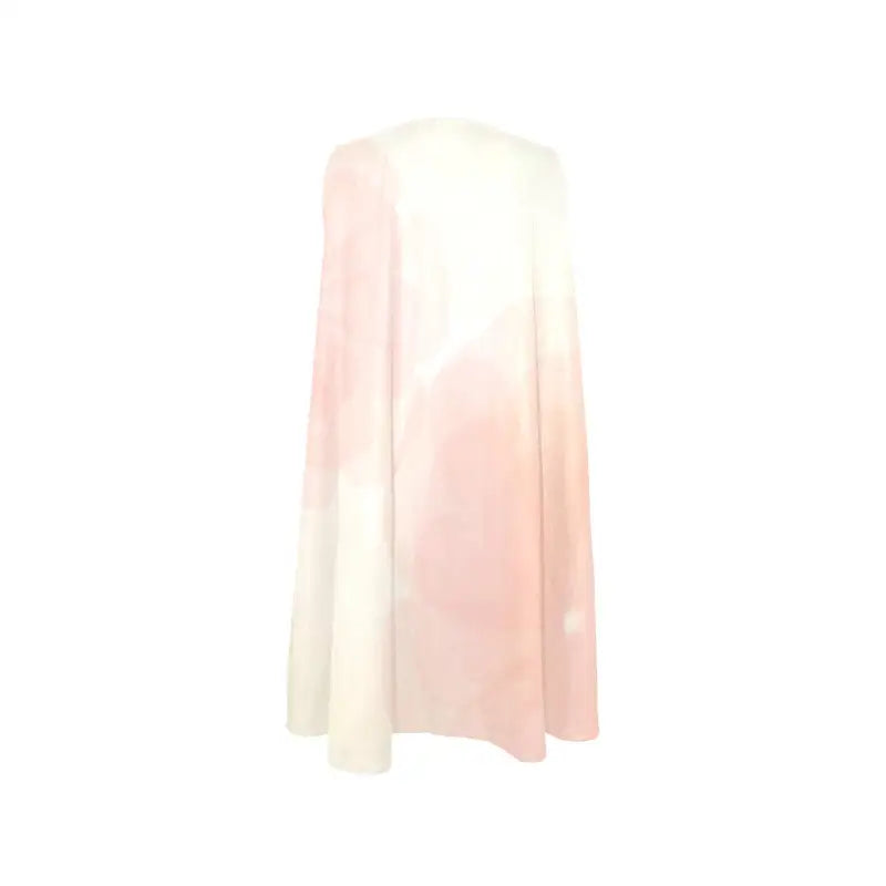 Flowing soft pink and white ombré cape enhances a women’s colorful sleeveless A-line look