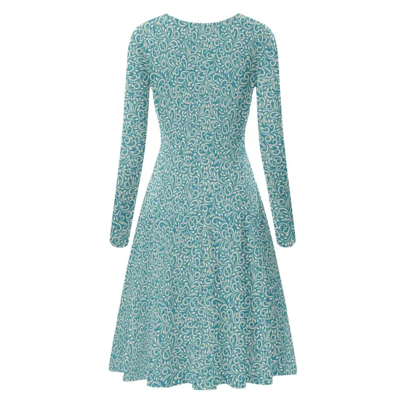 Long sleeve ruffle dress featuring teal and white blue florals with a flared skirt