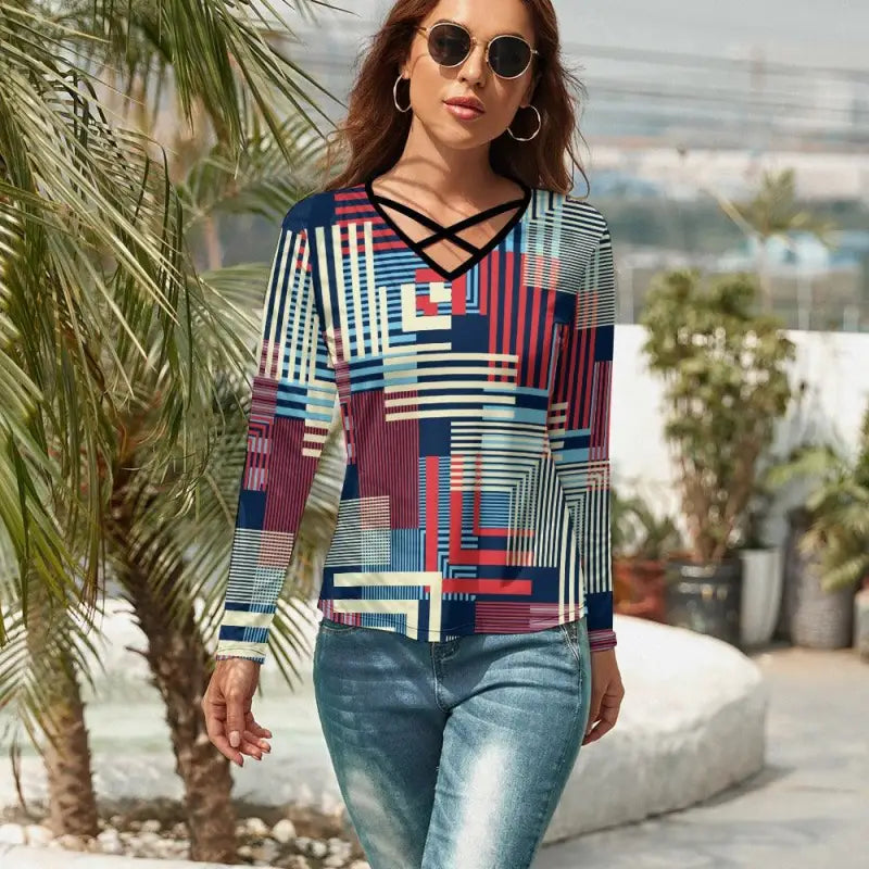 Colorful women’s geometric print long-sleeve top with a trendy criss-cross v-neck