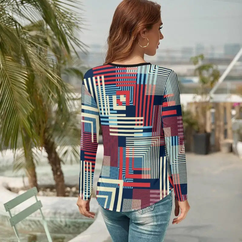 Woman in a colorful geometric print v-neck long-sleeved top, perfect for any occasion