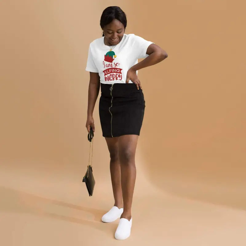 Woman rocks a Funny Christmas Short Sleeve T-Shirt with a cute skirt and sneakers