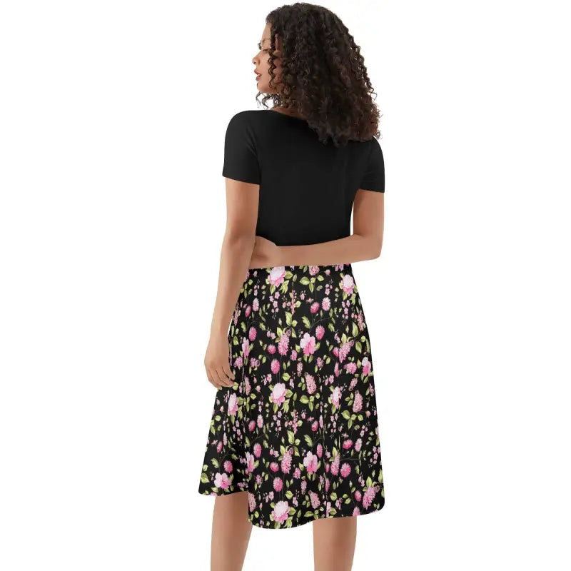 Floral print midi skirt with black background for a stylish floral swing dress look