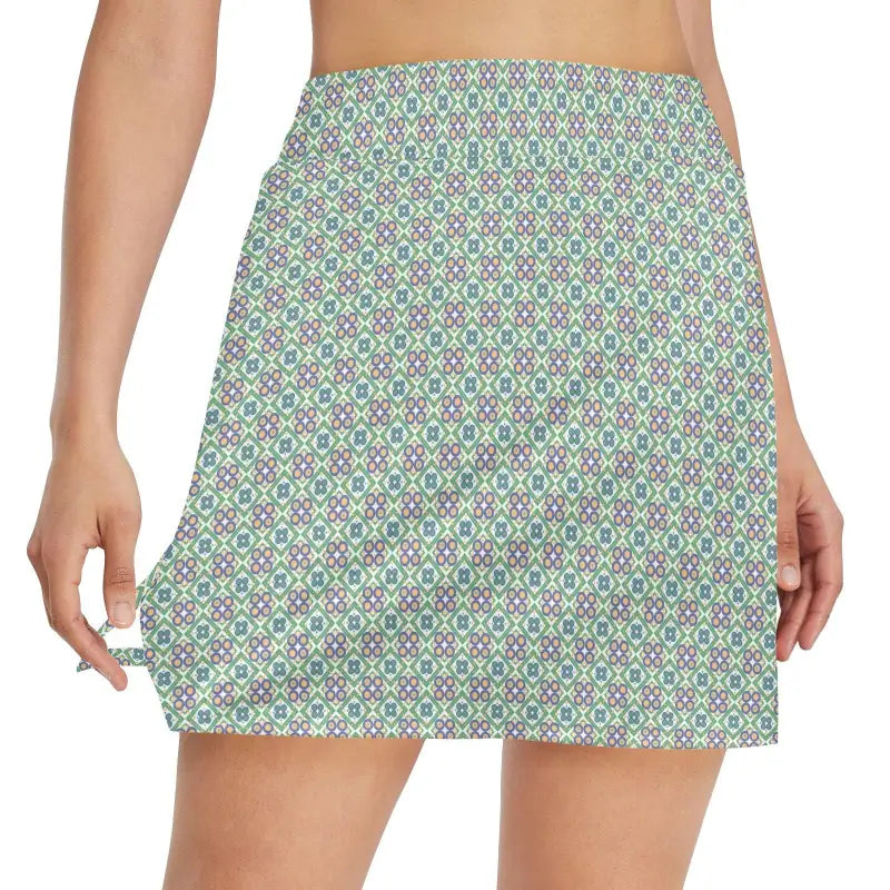 Patterned mini skirt in green, white, and purple perfect for a fun floral golf look