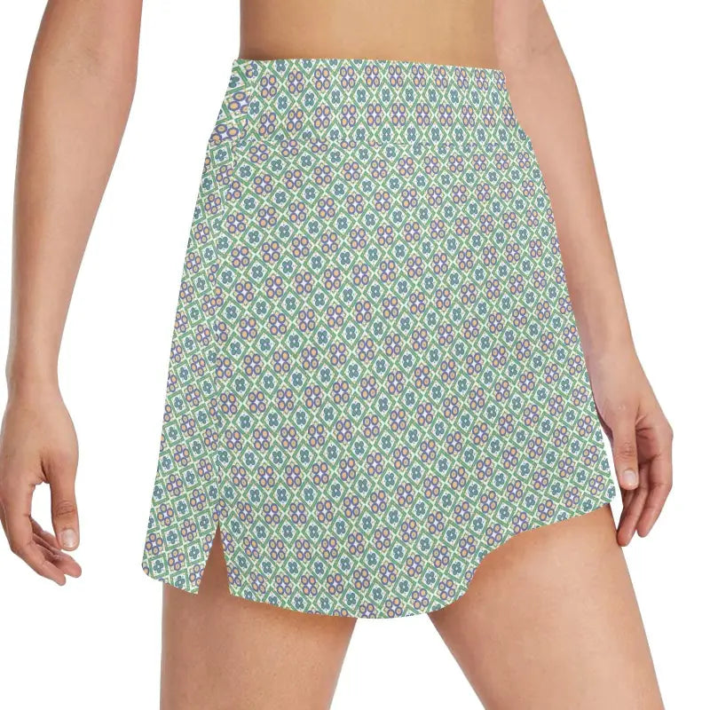 Patterned mini skirt with side slits in green and white, perfect floral golf skirt