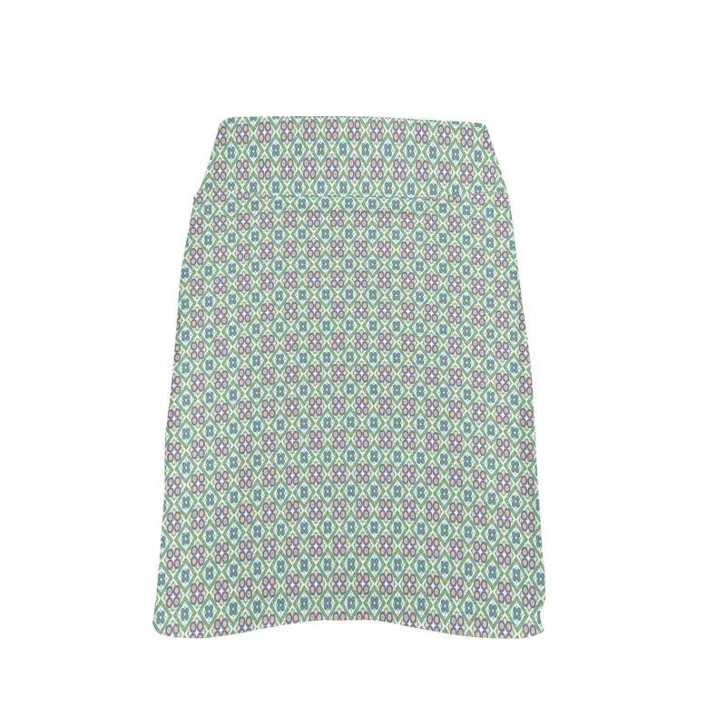 Knee-length women’s geometric floral golf skirt in green, blue, and white print