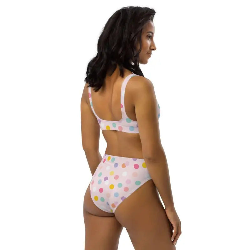 Woman with long dark hair rocking a pink polka dot sport bikini from the back