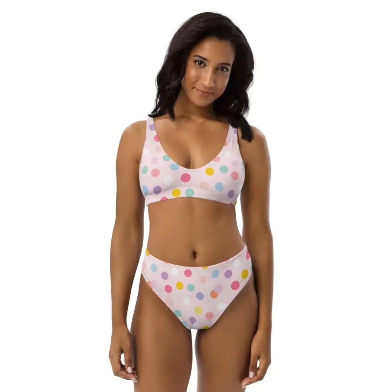 Two-piece pink polka dot sport bikini with colorful dots on a white background