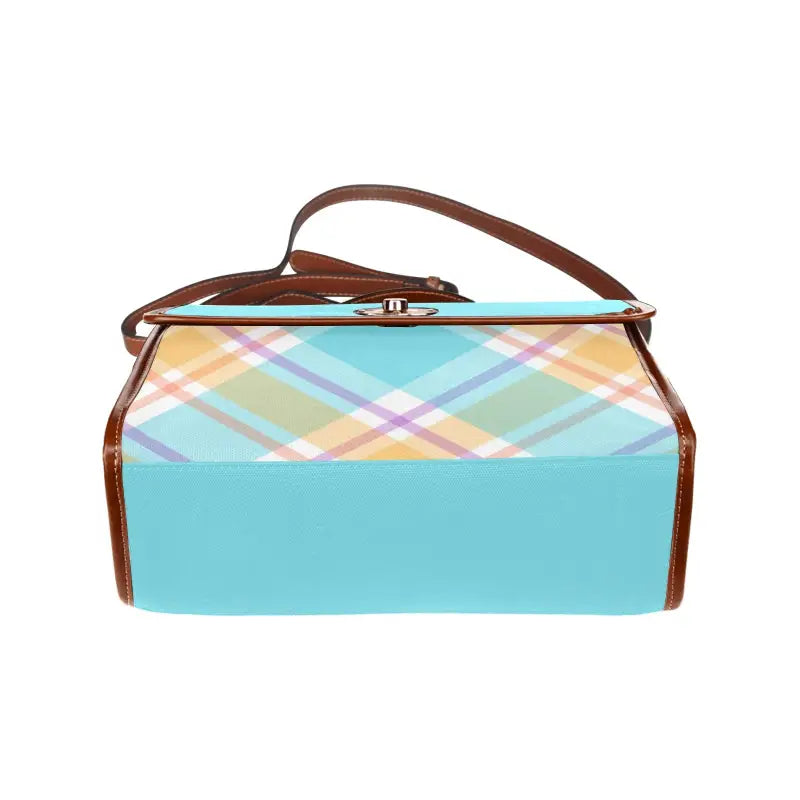Vintage-style blue plaid handbag with pastel pattern and brown leather trim
