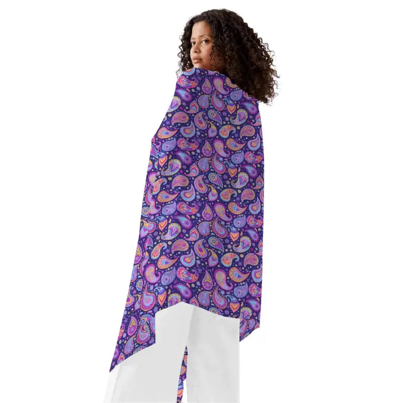 Colorful purple paisley sarong wrap draped stylishly over a woman’s shoulders