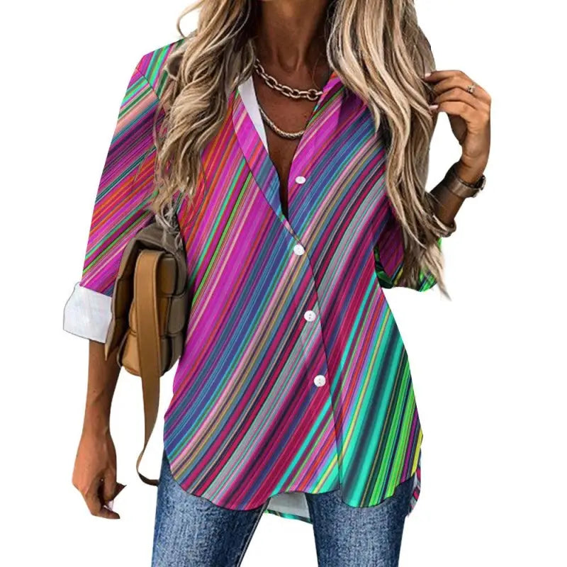 Colorful oversized women’s striped button-up shirt with vibrant diagonal lines