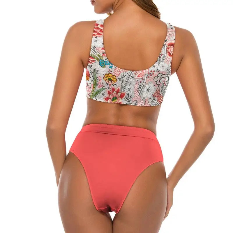 Floral bikini swimsuit with high-waisted coral bottom for sunny beach vibes