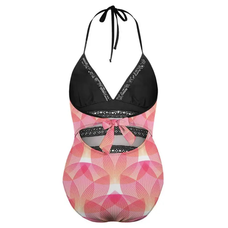 Women’s one-piece swimsuit featuring pink geometric print and black halter top