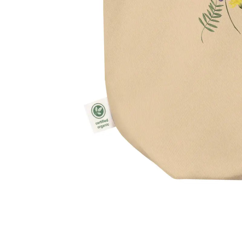 Beige tote bag with green certification label for Wildflower Hummingbird Eco style