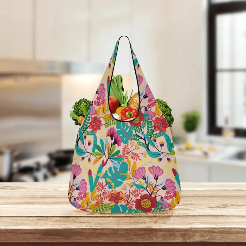 Colorful floral print grocery bag stuffed with fresh produce, perfect for eco-friendly shopping
