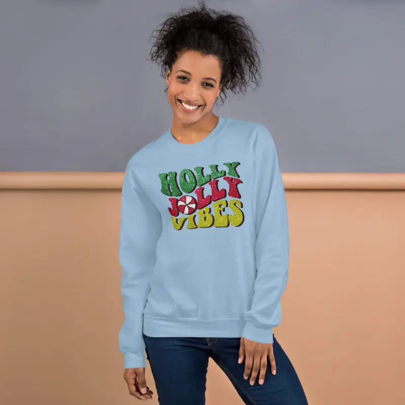 Light blue vibes Christmas sweatshirt with colorful Holly Jolly Vibes front print