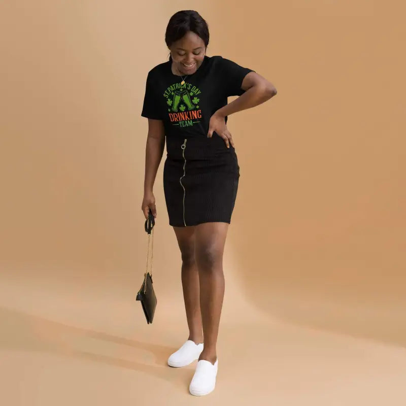Woman styling a Patrick’s Day Drinking Team shirt with a skirt and sneakers