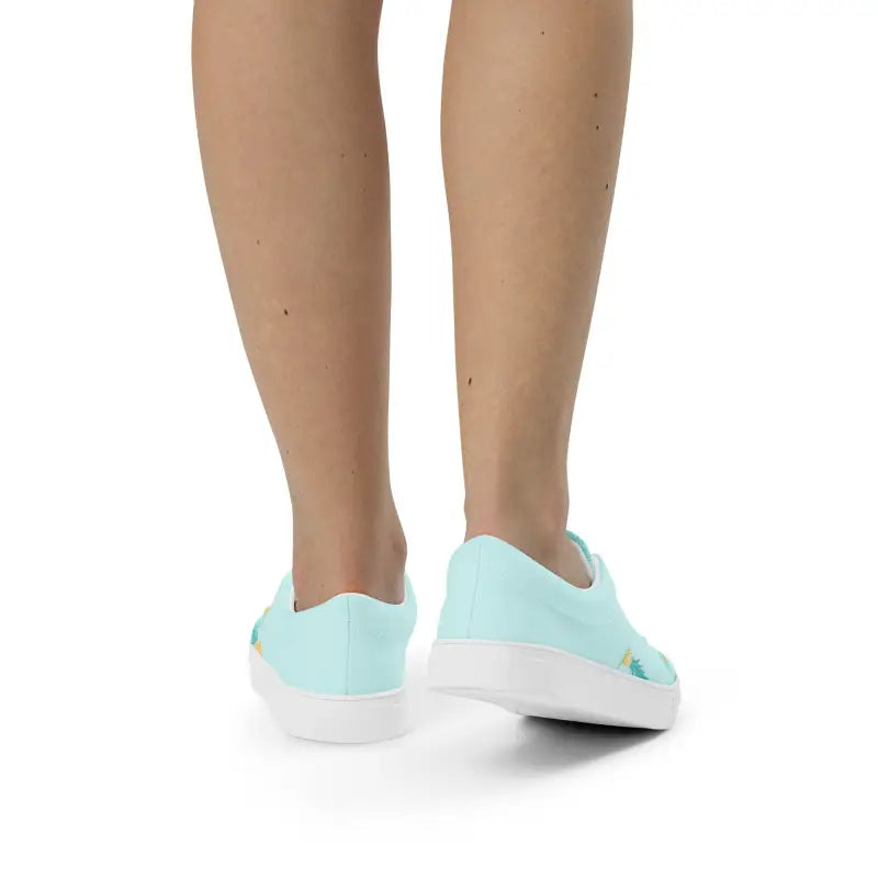 Light blue sneakers on feet, perfect for style with Women’s Pineapple Lace-Up Sneakers